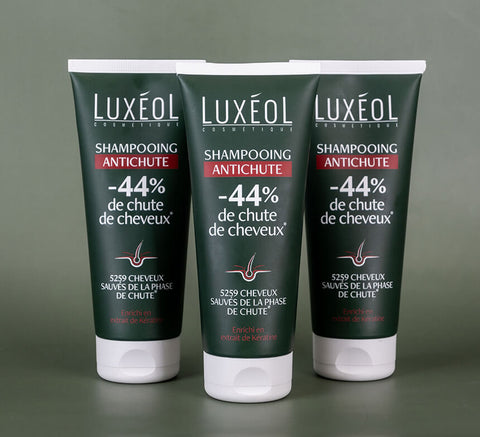 Trio of Luxéol Anti‑Hair Loss Shampoo tubes for range branding and capacity highlight.