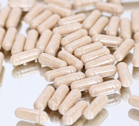 Luxéol capsules close‑up on light background.