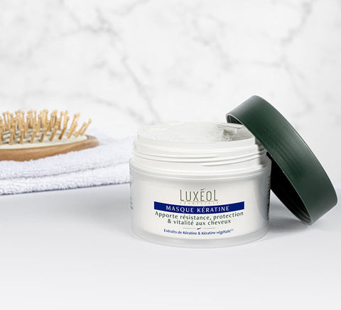 Open Keratin Mask lifestyle beside brush and towel; apply 2–3 times weekly, leave 5 minutes, rinse.